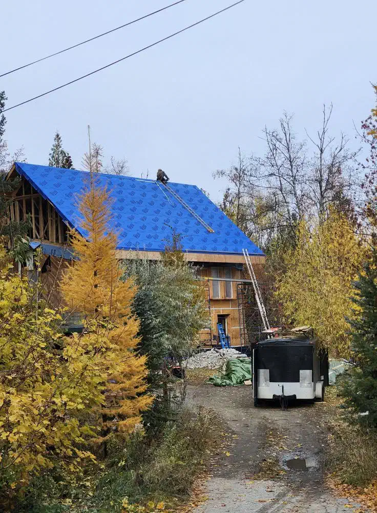 Roof deck dried in with synthetic underlayment before the finished roof goes on — West Kootenays