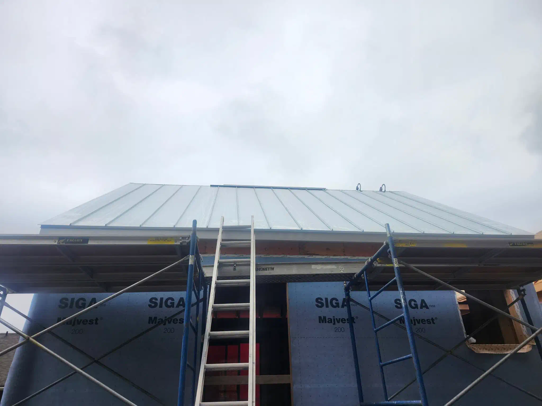 New standing seam steel roof on a home under construction — West Kootenays